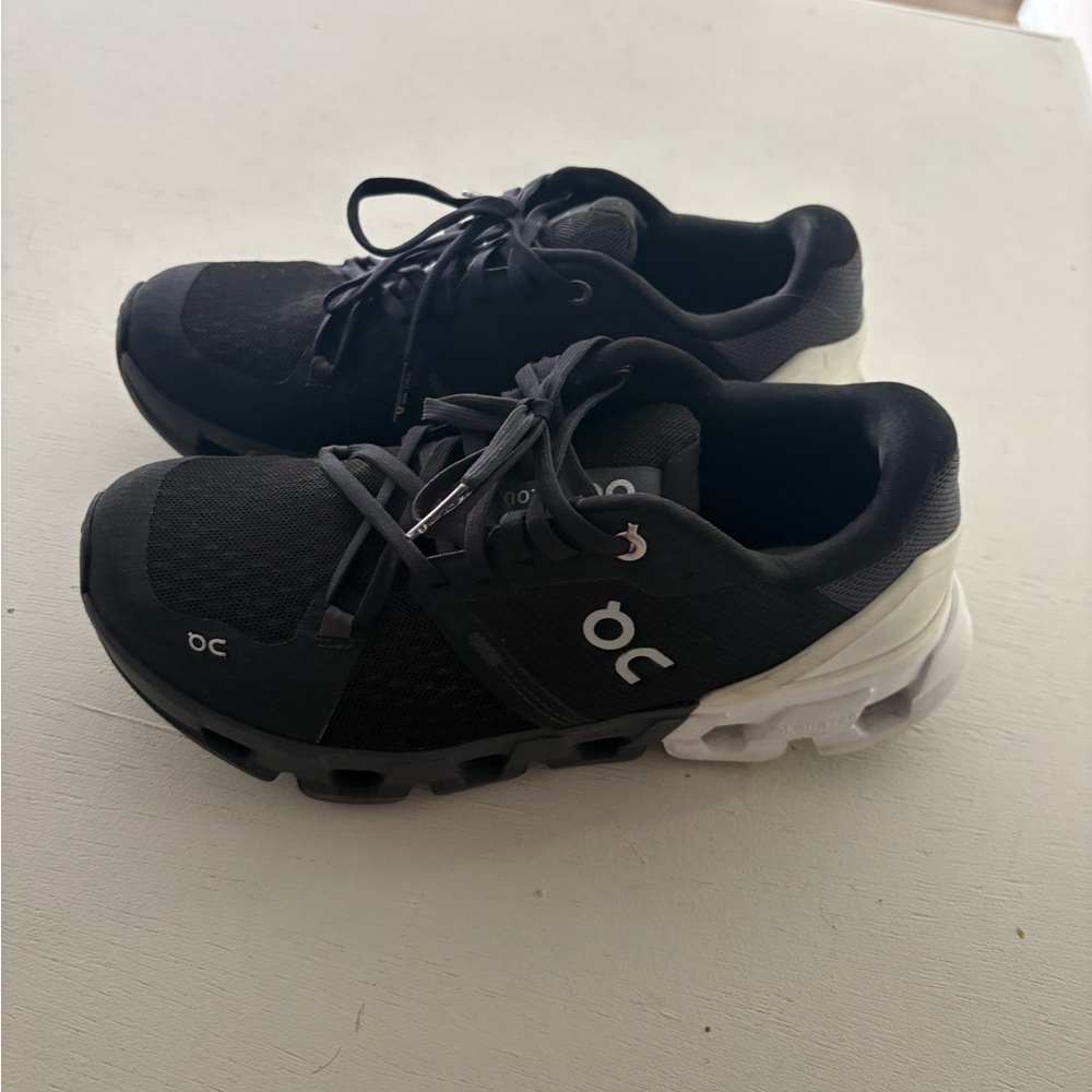 On cloud black and white sneakers